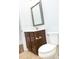 Bathroom featuring a vanity with sleek hardware and ample storage with a decorative mirror that adds a stylish touch at 1950 Menet St, Apex, NC 27502