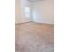 Bright carpeted bedroom features white trim and natural light from one large window at 1950 Menet St, Apex, NC 27502