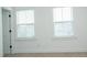 Bedroom features bright, natural light through two windows at 1950 Menet St, Apex, NC 27502