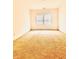 Bright bedroom with carpet, a window, and neutral paint ready for personalization at 1950 Menet St, Apex, NC 27502