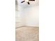 Neutral carpet and white trim in a well-lit bedroom with a modern ceiling fan at 1950 Menet St, Apex, NC 27502