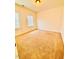 Bright bedroom featuring neutral walls, carpet, and natural light from the windows at 1950 Menet St, Apex, NC 27502