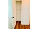 Bedroom closet featuring hardwood floors and a shelving unit at 1950 Menet St, Apex, NC 27502