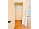 Closet with easy access, carpet, shelving, and a door for extra storage at 1950 Menet St, Apex, NC 27502