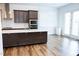 Modern kitchen equipped with stainless steel appliances, an island, and plenty of cabinet space at 1950 Menet St, Apex, NC 27502