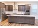 Spacious kitchen with a large island, stainless steel appliances, and ample storage at 1950 Menet St, Apex, NC 27502