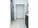 Spacious linen closet with multiple shelves for storage, located next to the shower at 1950 Menet St, Apex, NC 27502
