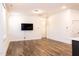 Bright living room with hard surface floors and recessed lighting at 1950 Menet St, Apex, NC 27502