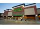 Exterior shot of a well-lit Publix store with ample parking, providing convenient grocery shopping at 1950 Menet St, Apex, NC 27502