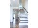Bright entryway featuring a staircase with hardwood treads and white risers at 1950 Menet St, Apex, NC 27502