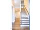 Stairway with hardwood treads and white risers, leading to the upper level at 1950 Menet St, Apex, NC 27502