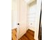 Pantry area featuring hardwood floors and adjustable shelving at 1950 Menet St, Apex, NC 27502