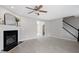 Inviting living room boasts a fireplace, hardwood floors, a ceiling fan, and a staircase at 197 Scranton Ct, Cameron, NC 28326