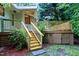 Wooden deck with staircase, perfect for outdoor dining, relaxing, and enjoying the private yard at 2004 Flagstone Pl, Raleigh, NC 27612