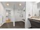 Bright bathroom featuring a walk-in shower with subway tile, a built-in bench, and neutral decor at 2004 Flagstone Pl, Raleigh, NC 27612