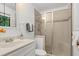 Neutral bathroom with a glass shower enclosure and coordinated fixtures at 2004 Flagstone Pl, Raleigh, NC 27612