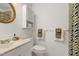 Bright bathroom featuring a stylish gold mirror, white cabinets, and fresh towels at 2004 Flagstone Pl, Raleigh, NC 27612