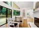 Sunlit dining area features sliding glass doors to the deck and backyard at 2004 Flagstone Pl, Raleigh, NC 27612