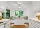 Eat-in kitchen features banquette seating, built-in cabinets and modern lighting at 2004 Flagstone Pl, Raleigh, NC 27612