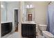 Bathroom with vanity, toilet, and mirror with a connecting bedroom at 201 Margaret Mann Way, Pittsboro, NC 27312