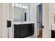 Bathroom with vanity and drawers and mirrors with a connecting room at 201 Margaret Mann Way, Pittsboro, NC 27312