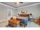 Relaxing bedroom features a ceiling fan, area rug, and stylish decor with a guitar at 201 Margaret Mann Way, Pittsboro, NC 27312