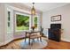 Bright breakfast nook with bay window, wood floors, and decorative pendant lighting at 201 Margaret Mann Way, Pittsboro, NC 27312