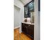 Butler's pantry features dark cabinetry, granite countertops, and glass door cabinets at 201 Margaret Mann Way, Pittsboro, NC 27312
