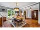 Charming dining room with hardwood floors, a wooden table, and stylish decor at 201 Margaret Mann Way, Pittsboro, NC 27312