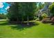 Manicured lawn and mature landscaping lead to this charming two-story home with stone accents at 201 Margaret Mann Way, Pittsboro, NC 27312