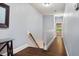 Upstairs hallway featuring hardwood floors at 201 Margaret Mann Way, Pittsboro, NC 27312