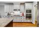 Gourmet kitchen featuring white cabinetry, stainless steel appliances, and granite countertops at 201 Margaret Mann Way, Pittsboro, NC 27312