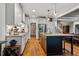 Spacious kitchen with large center island, stainless steel appliances, and hardwood floors throughout at 201 Margaret Mann Way, Pittsboro, NC 27312