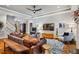 Spacious living room with hardwood floors, tray ceiling, and modern decor at 201 Margaret Mann Way, Pittsboro, NC 27312