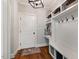 Functional mudroom with built-in storage, bench seating, and coat hooks at 201 Margaret Mann Way, Pittsboro, NC 27312