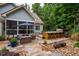 Stone patio featuring an outdoor kitchen and bar seating at 201 Margaret Mann Way, Pittsboro, NC 27312