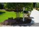 Well maintained lawn and landscaping accent this home's roadside appeal at 201 Margaret Mann Way, Pittsboro, NC 27312