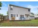Exterior view of a two-story home with a patio and lush green lawn at 202 Stonecreek Dr, Apex, NC 27539