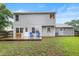 The backyard shows the home's exterior with patio, lawn, and light gray siding at 202 Stonecreek Dr, Apex, NC 27539