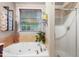 Bathroom with soaking tub with jets and tiled surround at 202 Stonecreek Dr, Apex, NC 27539
