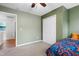 Bedroom features closet and window with view of the backyard at 202 Stonecreek Dr, Apex, NC 27539
