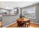 Cozy dining area with a round wooden table and a view of the kitchen at 202 Stonecreek Dr, Apex, NC 27539