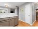 Bright, updated kitchen with hardwood flooring. View into the dining area at 202 Stonecreek Dr, Apex, NC 27539
