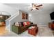 Comfortable living room featuring a large sectional sofa and stylish decor at 202 Stonecreek Dr, Apex, NC 27539