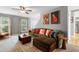 Comfortable living room featuring a large sectional sofa and stylish decor at 202 Stonecreek Dr, Apex, NC 27539