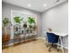 A bright office space with natural light and a modern desk and blue chair at 202 Stonecreek Dr, Apex, NC 27539