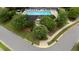 Aerial view of pool featuring lounge chairs and bathhouse in a treed area at 202 Stonecreek Dr, Apex, NC 27539