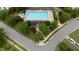 Overhead of the community pool with lounge chairs and trees surrounding it at 202 Stonecreek Dr, Apex, NC 27539