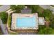Aerial view of community pool with lounge chairs and umbrellas at 202 Stonecreek Dr, Apex, NC 27539