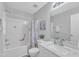 White bathroom featuring a tub and shower combination, toilet, and sink with marble countertop at 220 Misty Groves Cir, Morrisville, NC 27560